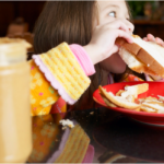 Child Eating Sandwich
